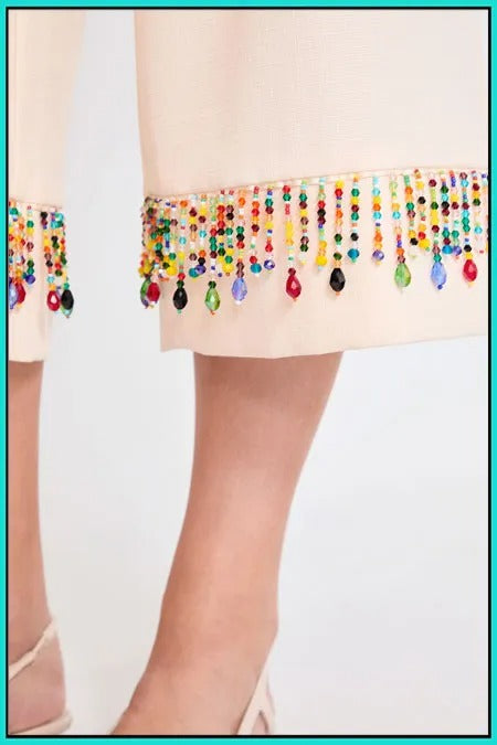 Pantalón midi con piedras